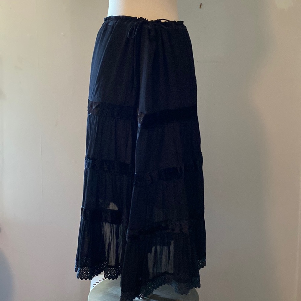 Sheer black gypsy skirt with liner, velvet trim. Ruffle at bottom.